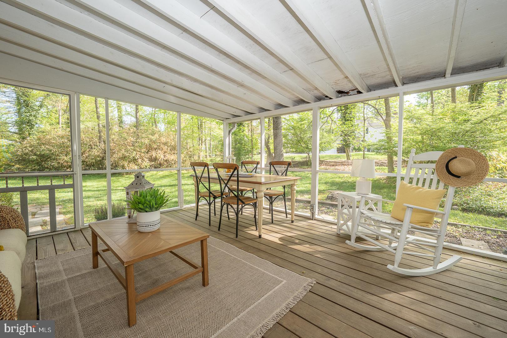 340 Chester Road Devon, PA 19333 - Photo 21 of 48 a living room with furniture and a floor to ceiling window