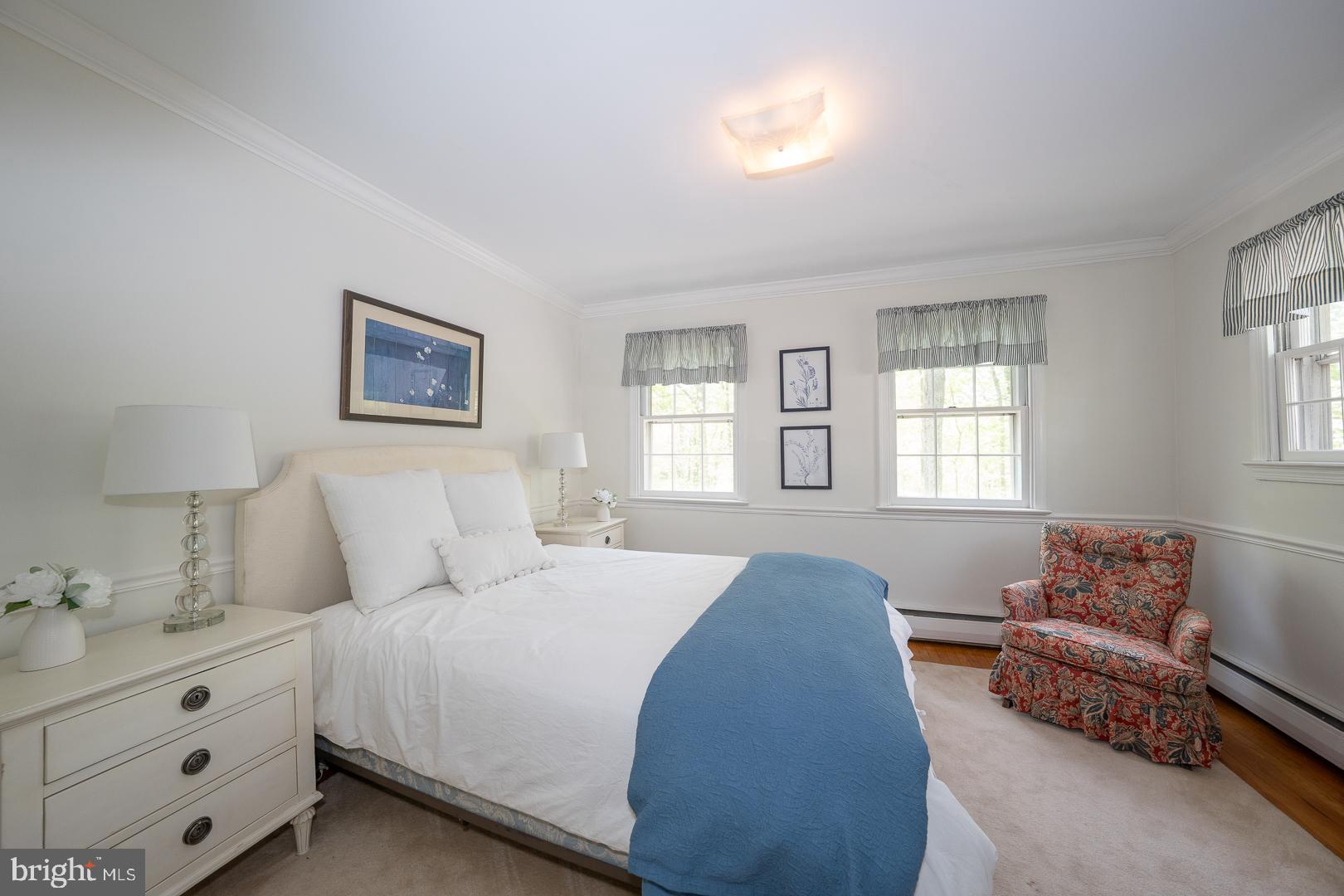 340 Chester Road Devon, PA 19333 - Photo 30 of 48 a spacious bedroom with a bed and a couch