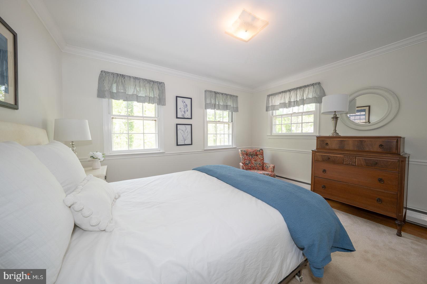 340 Chester Road Devon, PA 19333 - Photo 31 of 48 a bedroom with a bed and window with chair