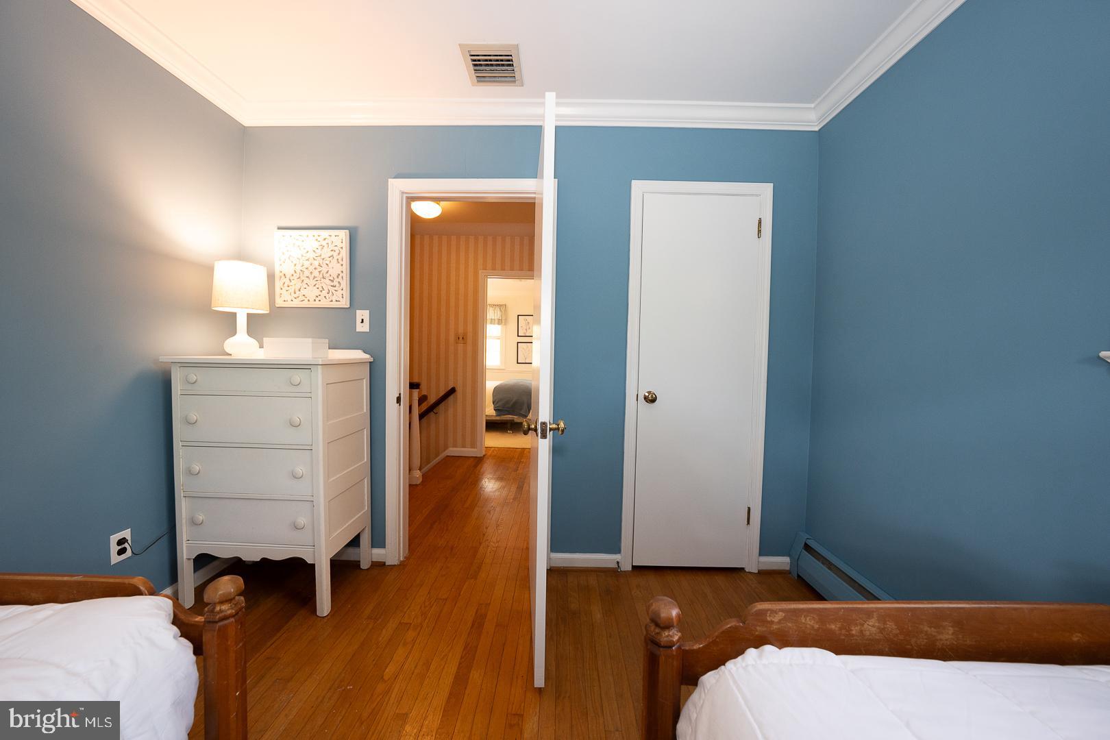 340 Chester Road Devon, PA 19333 - Photo 33 of 48 a bedroom with a bed and a cabinets