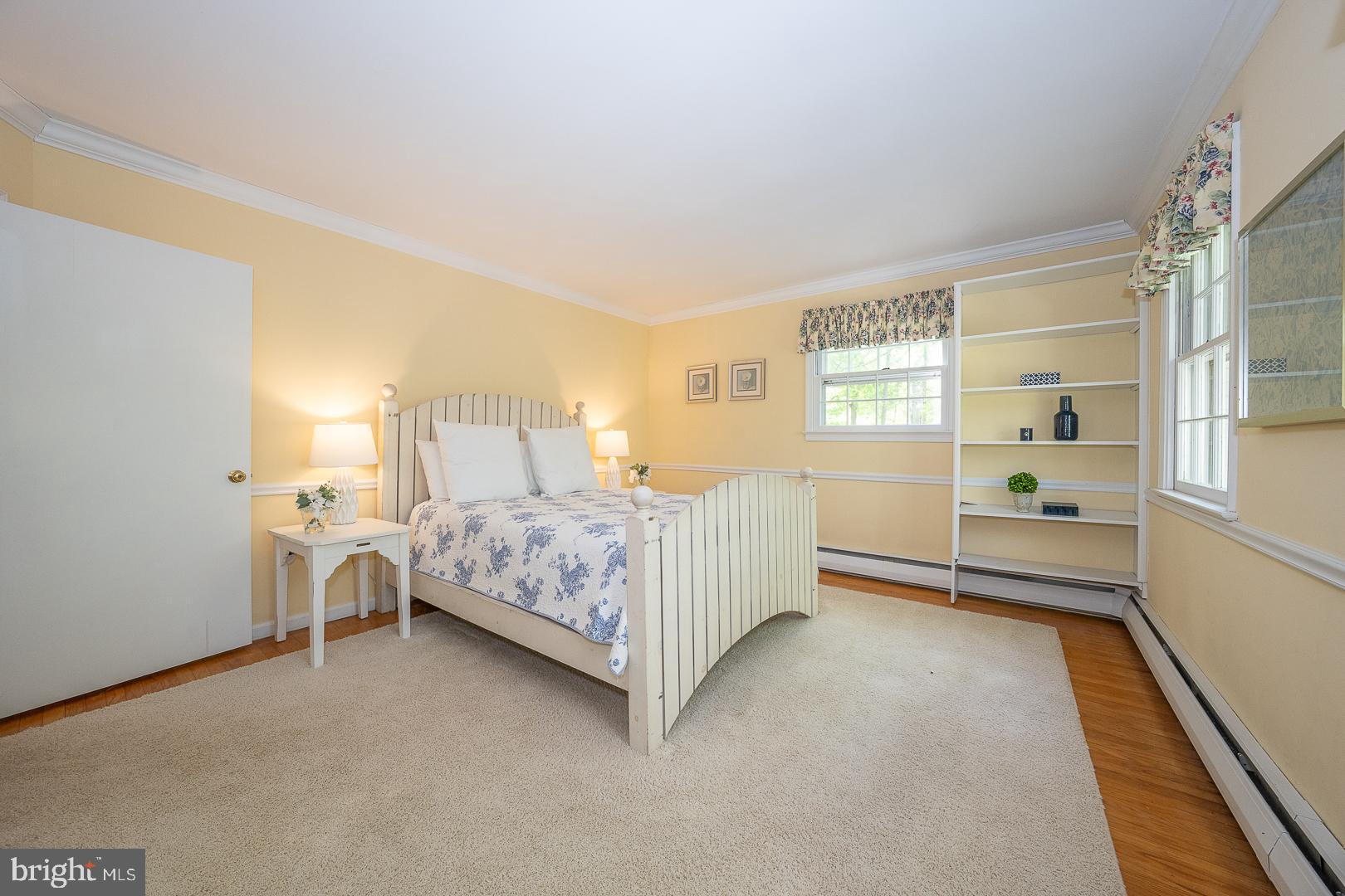 340 Chester Road Devon, PA 19333 - Photo 35 of 48 a bedroom with a large bed and a window