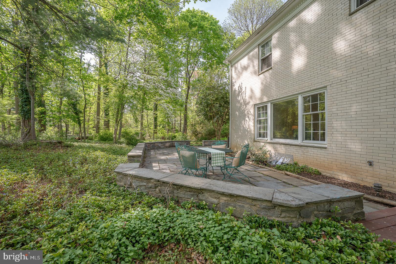 340 Chester Road Devon, PA 19333 - Photo 43 of 48 a house view with swimming pool and garden