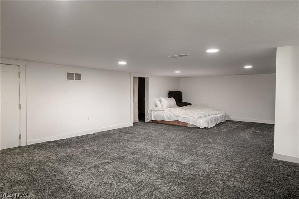 9419 Robinson Road Chardon, OH 44024 - Photo 35 of 49 Spacious finished room featuring plush gray carpeting, recessed lighting, and crisp white walls