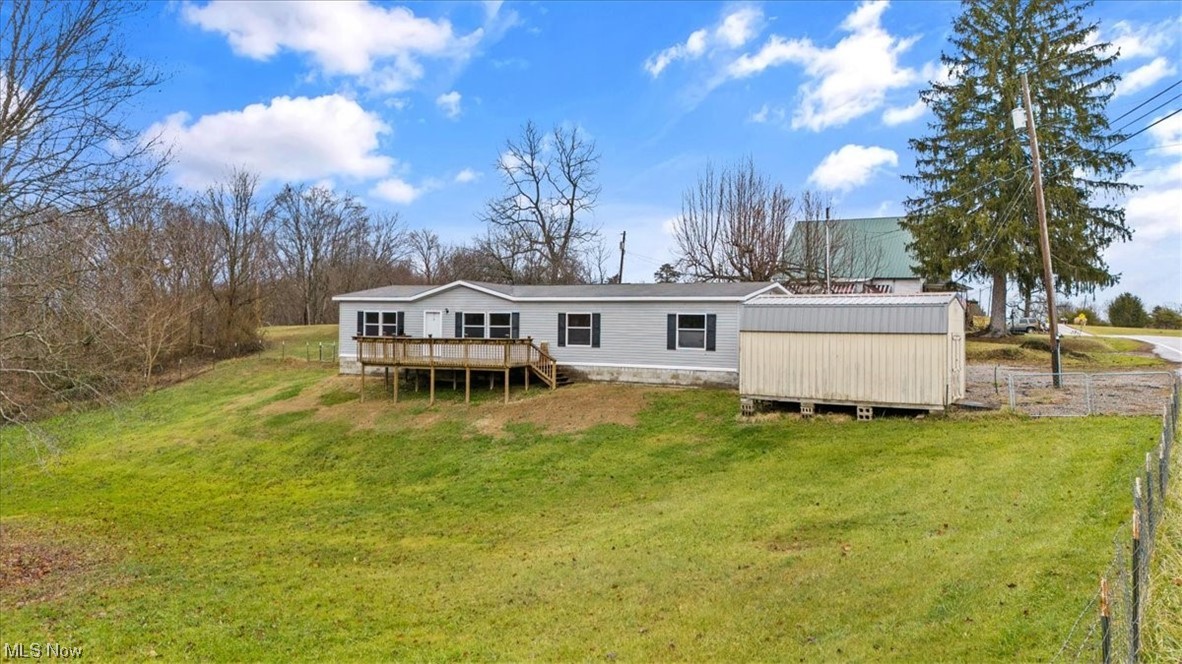 68656 Highway 124 Reedsville, OH 45772 - Photo 3 of 29 Back of house with a wooden deck and a yard