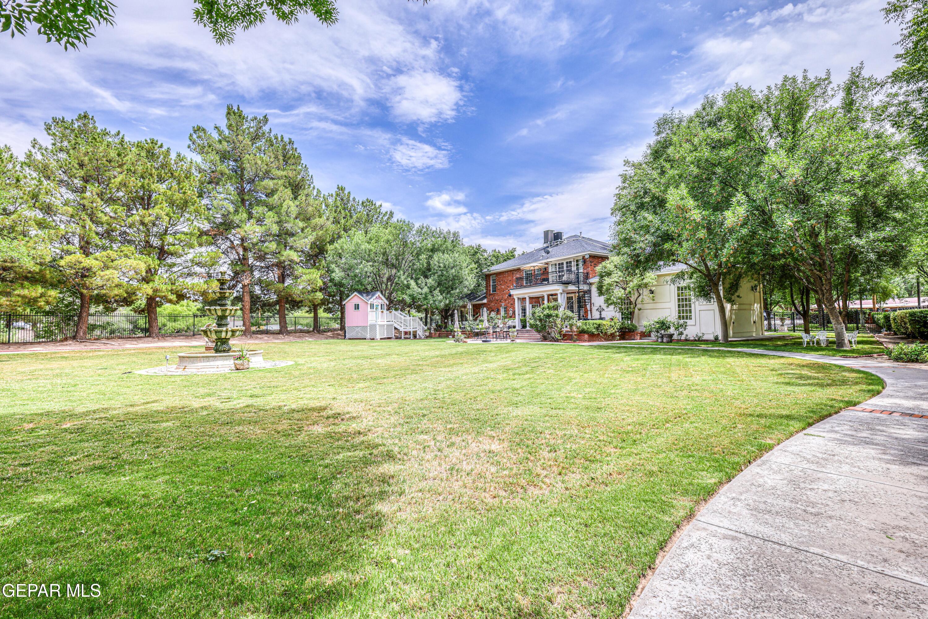 501 Country Club Road El Paso, TX 79932 - Photo 83 of 88 a view of yard with swimming pool and green space