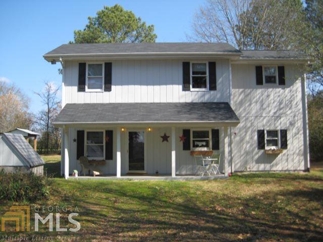 3250 Buckhead Road Madison, GA 30650 - Photo 1 of 1 front view of a house with a yard