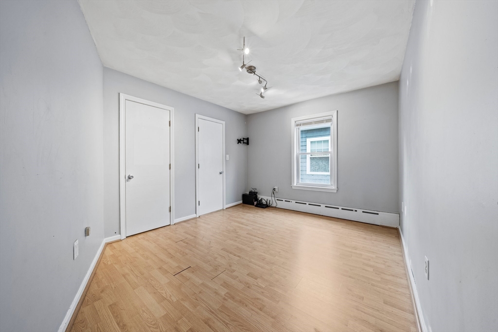 26 Sherman Road Braintree, MA 02184 - Photo 19 of 42 a view of empty room with wooden floor and fan