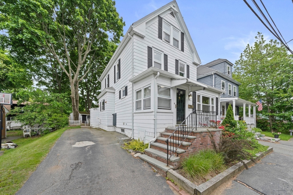 26 Sherman Road Braintree, MA 02184 - Photo 2 of 42 front view of a house with a bench