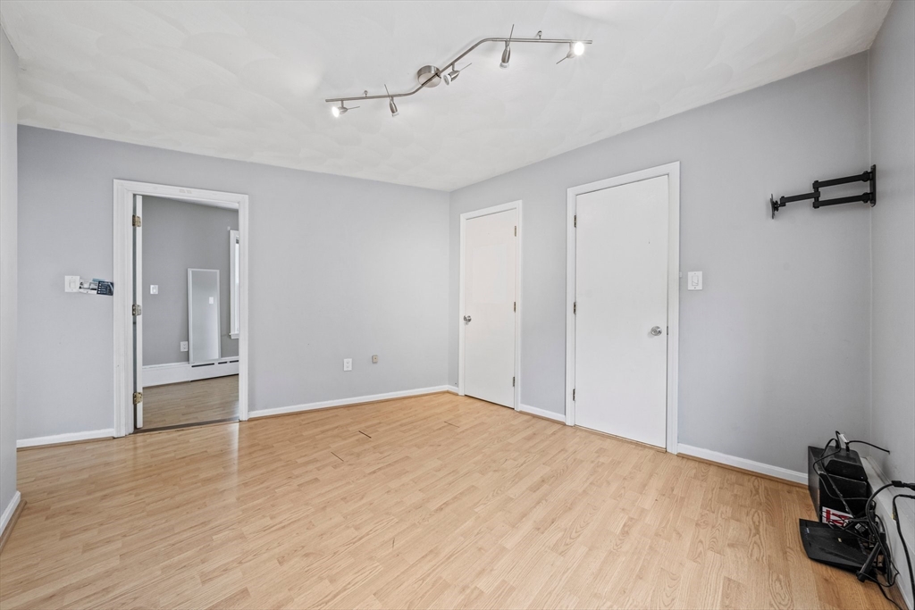 26 Sherman Road Braintree, MA 02184 - Photo 21 of 42 a view of empty room with wooden floor and fan