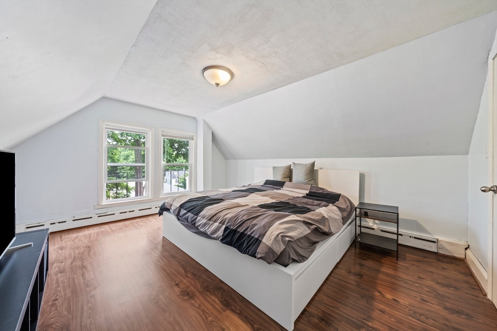 26 Sherman Road Braintree, MA 02184 - Photo 27 of 42 a bedroom with a bed and a large window