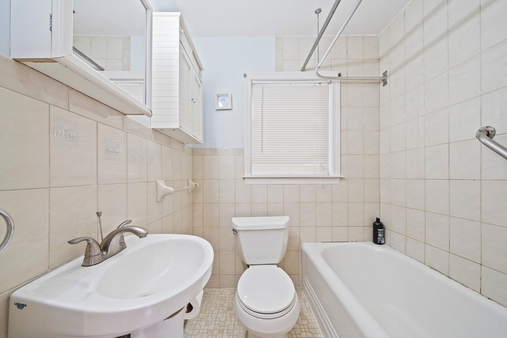 26 Sherman Road Braintree, MA 02184 - Photo 31 of 42 a bathroom with a sink a toilet and shower