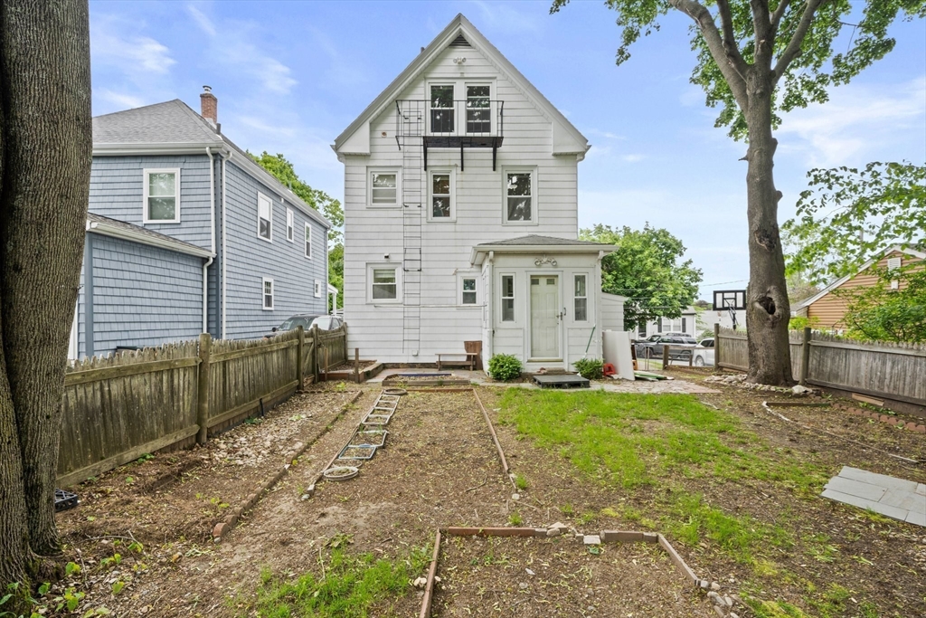 26 Sherman Road Braintree, MA 02184 - Photo 33 of 42 a view of a yard in front of a house with large tree