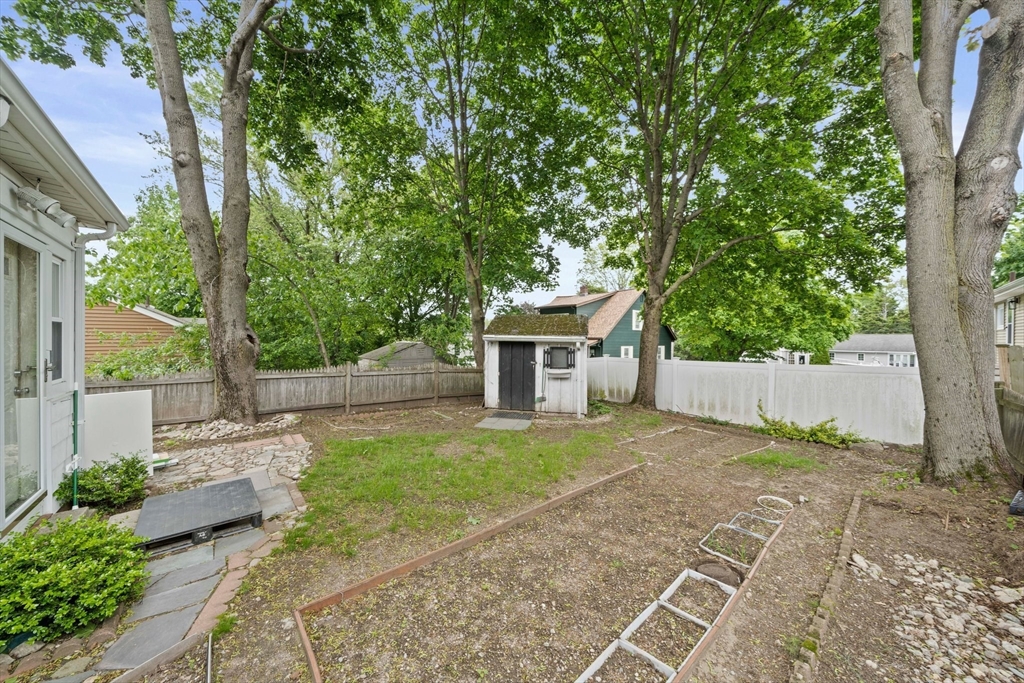 26 Sherman Road Braintree, MA 02184 - Photo 34 of 42 a view of a house with a yard and large tree