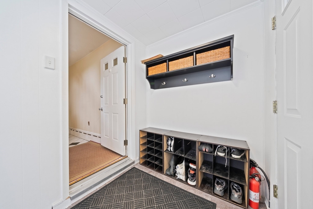 26 Sherman Road Braintree, MA 02184 - Photo 35 of 42 a view of a hallway with wooden floor and stairs