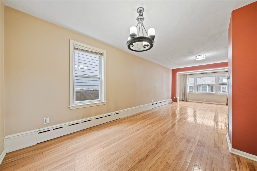 26 Sherman Road Braintree, MA 02184 - Photo 9 of 42 a view of an empty room with window and wooden floor