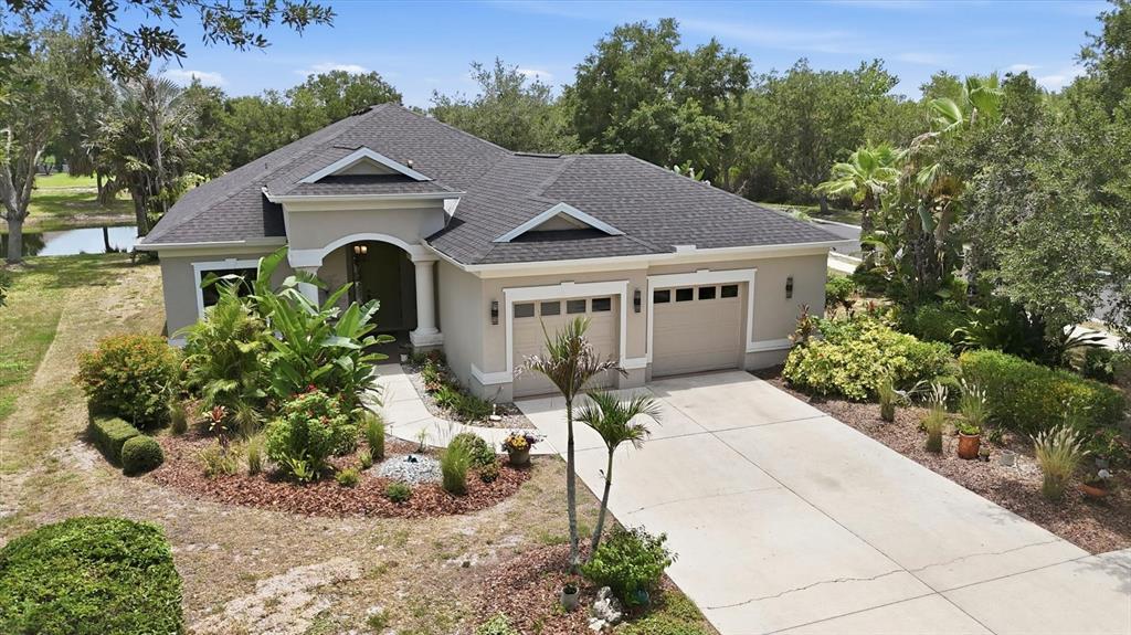 428 Snapdragon Loop Bradenton, FL 34212 - Photo 4 of 33 a front view of a house with a yard