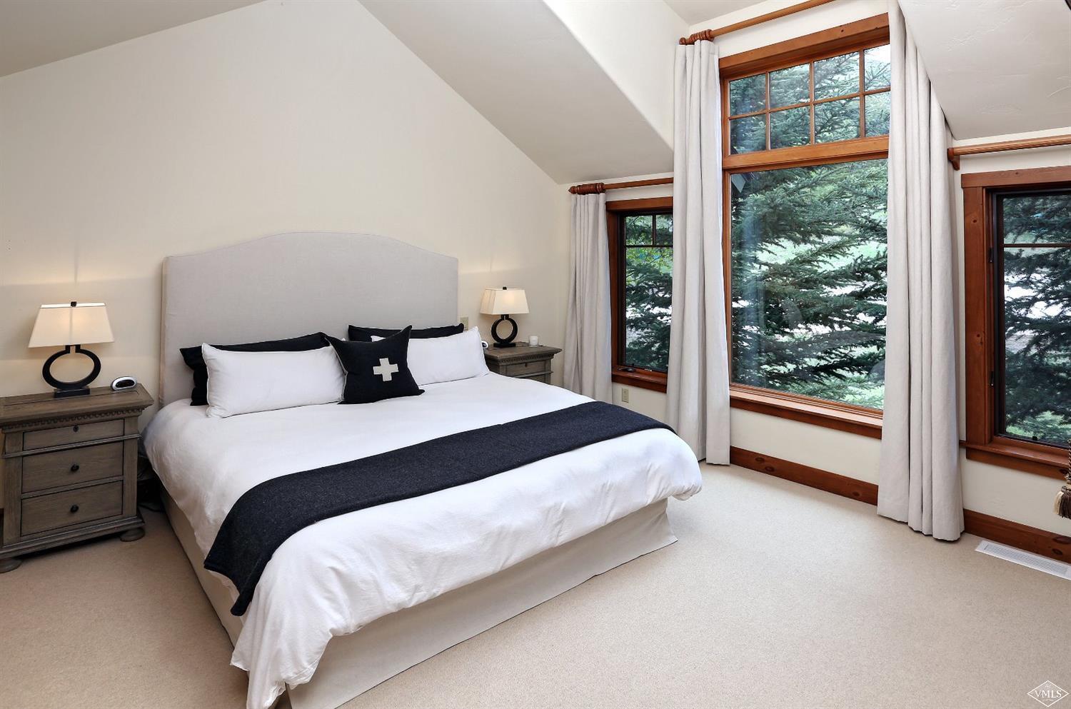 404 Cresta Road Edwards, CO 81632 - Photo 11 of 25 a bedroom with a large bed and a large window