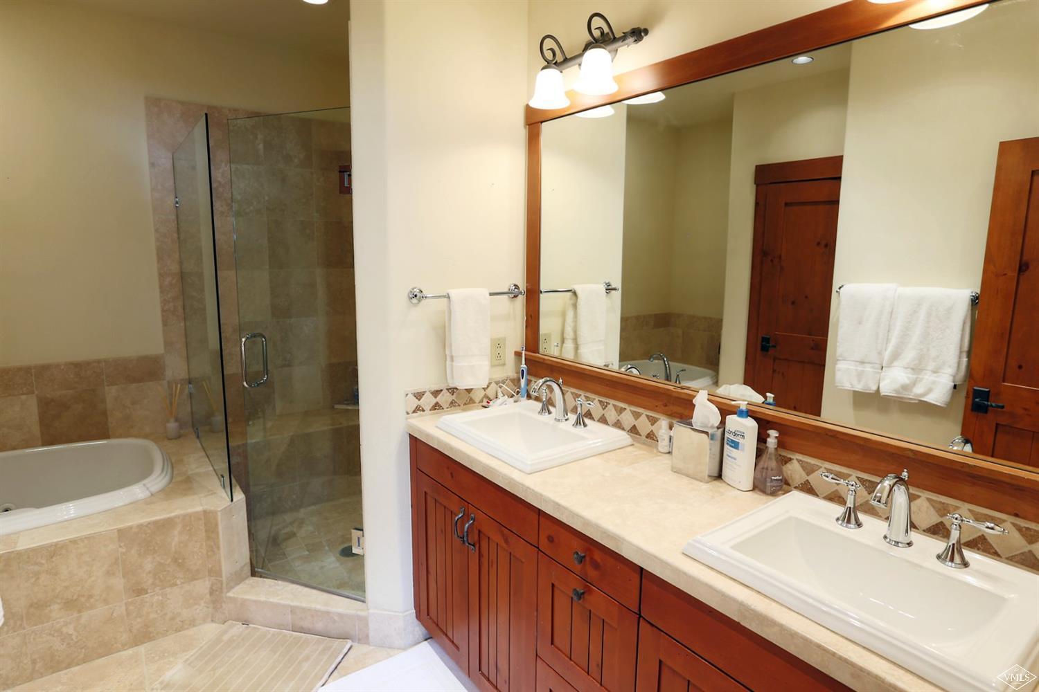 404 Cresta Road Edwards, CO 81632 - Photo 12 of 25 a bathroom with a bathtub shower sink and mirror