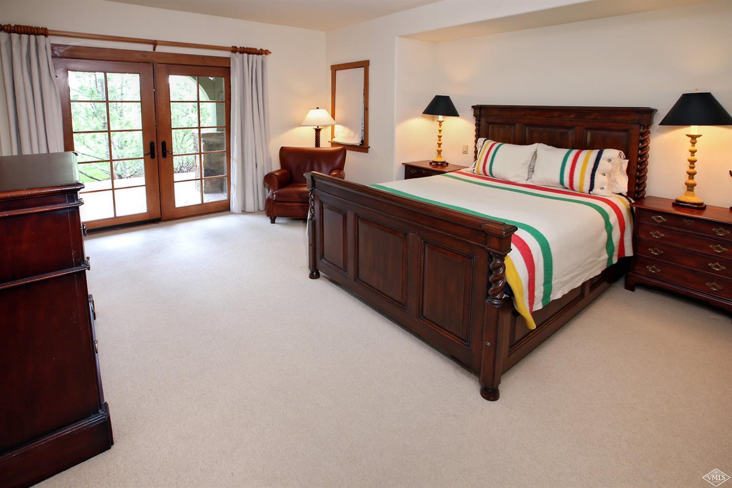 404 Cresta Road Edwards, CO 81632 - Photo 13 of 25 a bed room with a bed and a large window