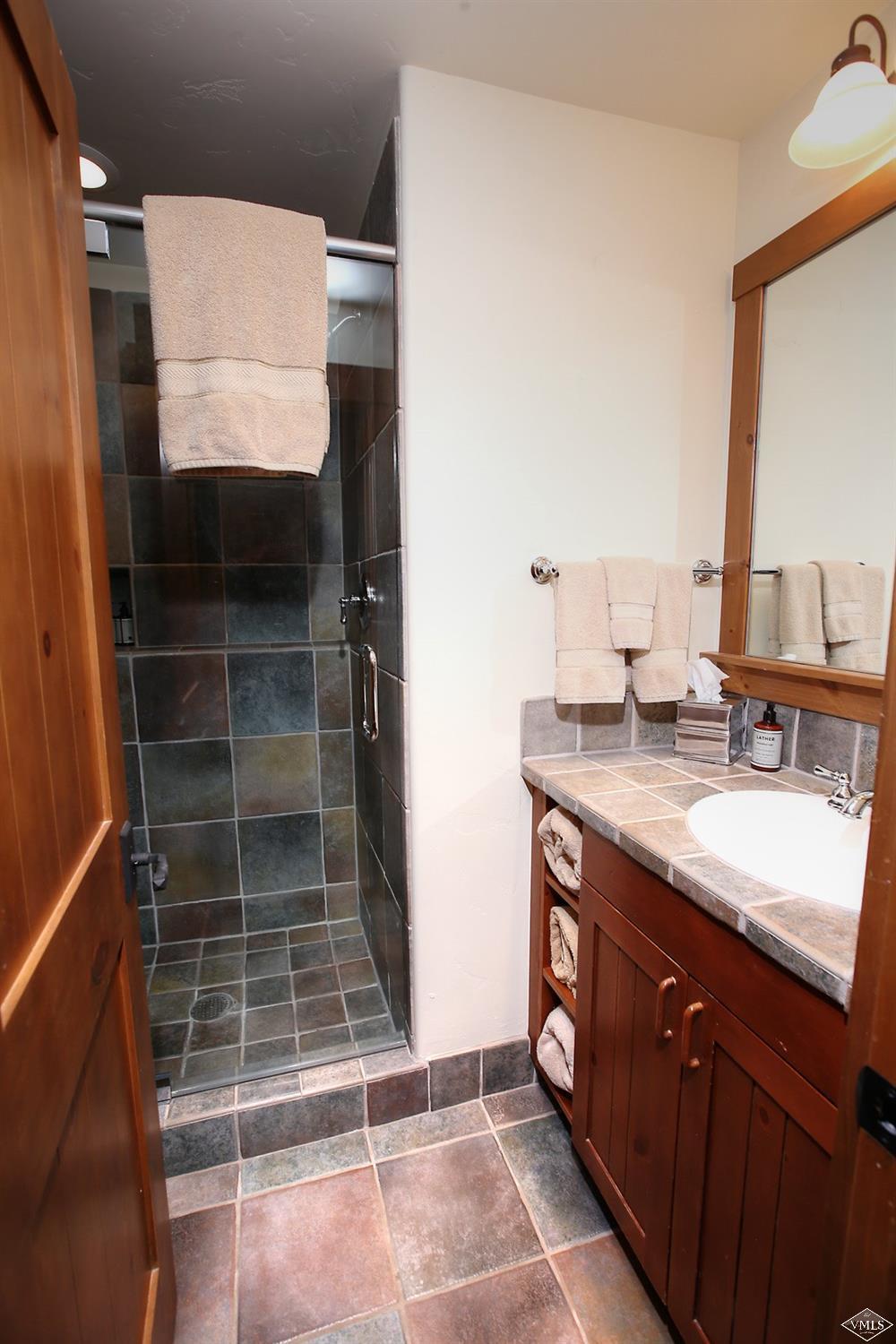 404 Cresta Road Edwards, CO 81632 - Photo 18 of 25 a bathroom with a sink and a mirror