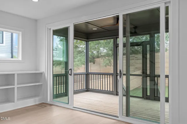 a view of entryway and hall with wooden floor