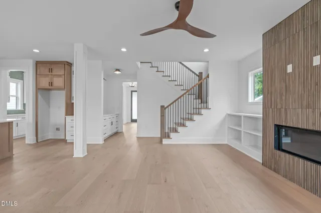 a view of kitchen with refrigerator and window