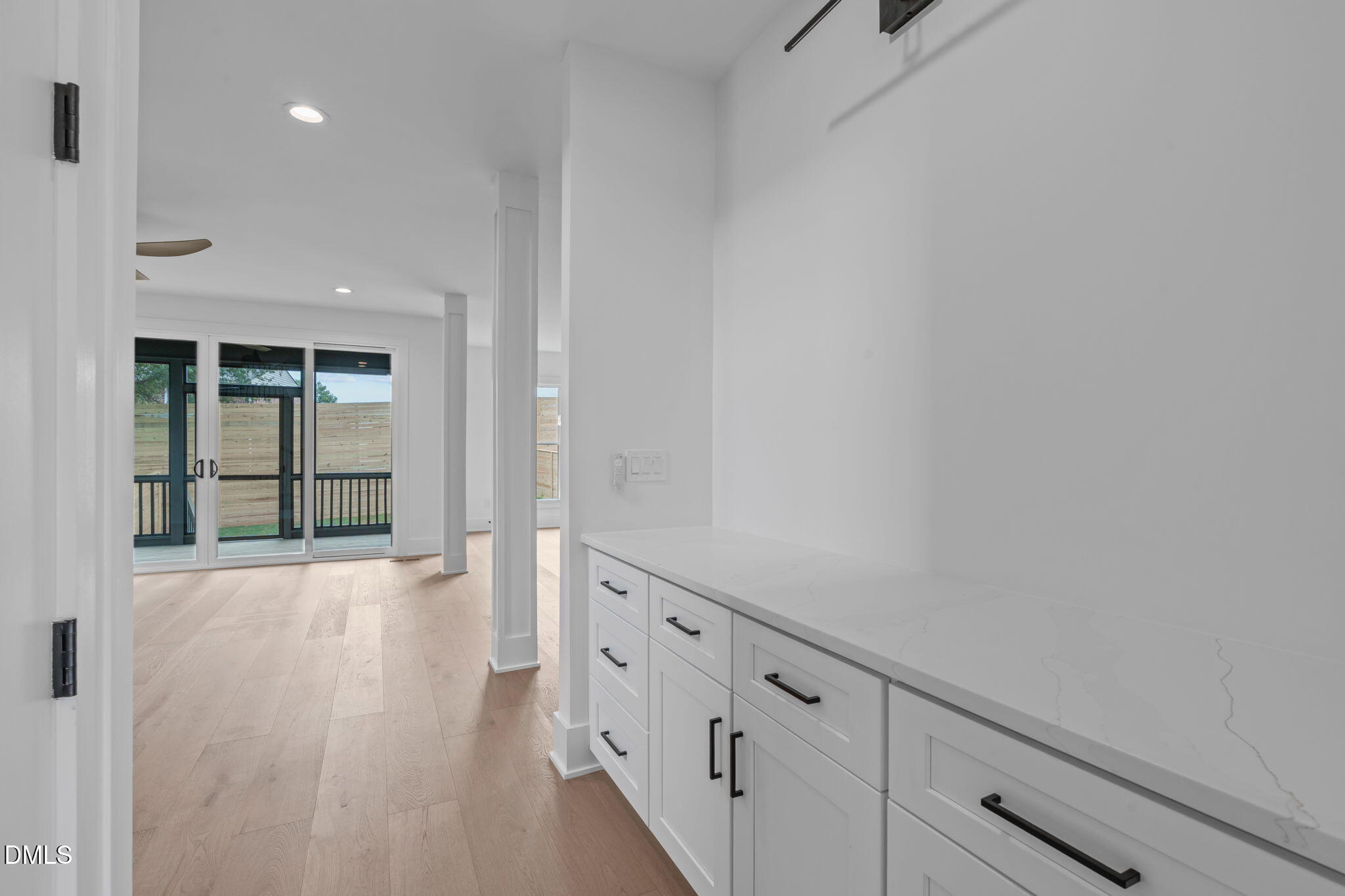 1012 Addison Place Raleigh, NC 27610 - Photo 22 of 56 a view of an empty room with wooden floor and cabinet