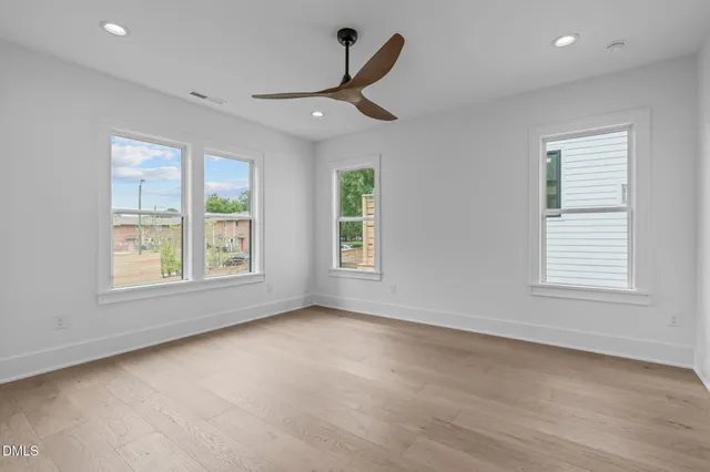 a bathroom with a double vanity sink mirror and shower