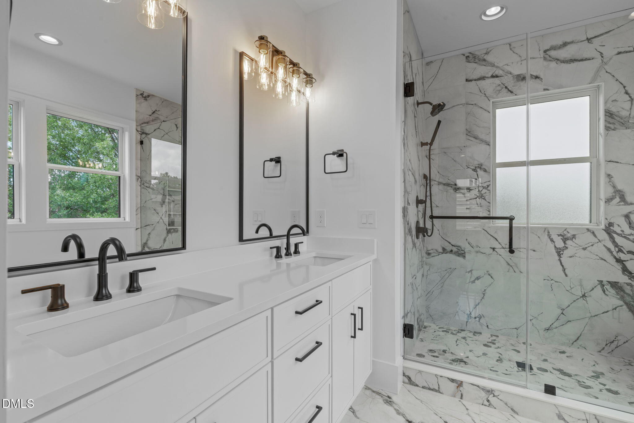 1012 Addison Place Raleigh, NC 27610 - Photo 26 of 56 a bathroom with a double vanity sink mirror and shower