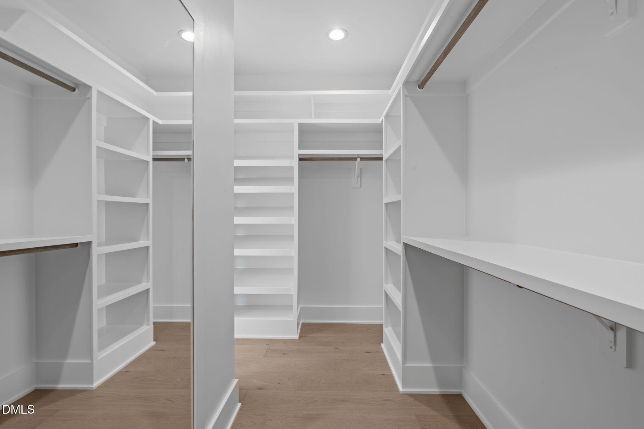 1012 Addison Place Raleigh, NC 27610 - Photo 27 of 56 a view of walk in closet with empty racks
