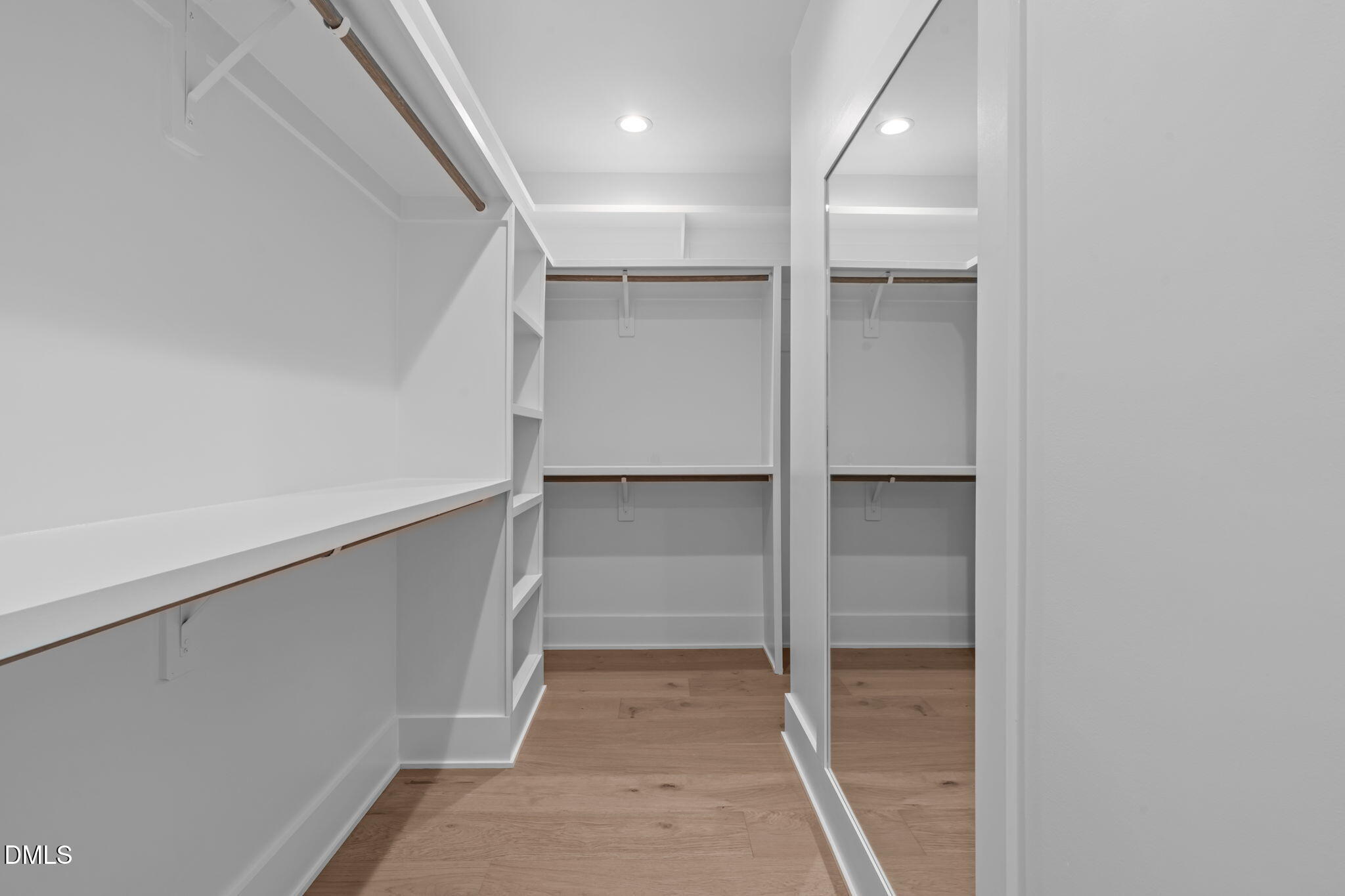 1012 Addison Place Raleigh, NC 27610 - Photo 28 of 56 a view of walk in closet with empty racks