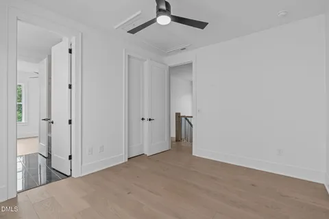 a bathroom with a double vanity sink toilet and shower