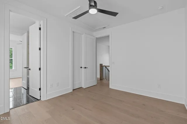 a bathroom with a double vanity sink toilet and shower