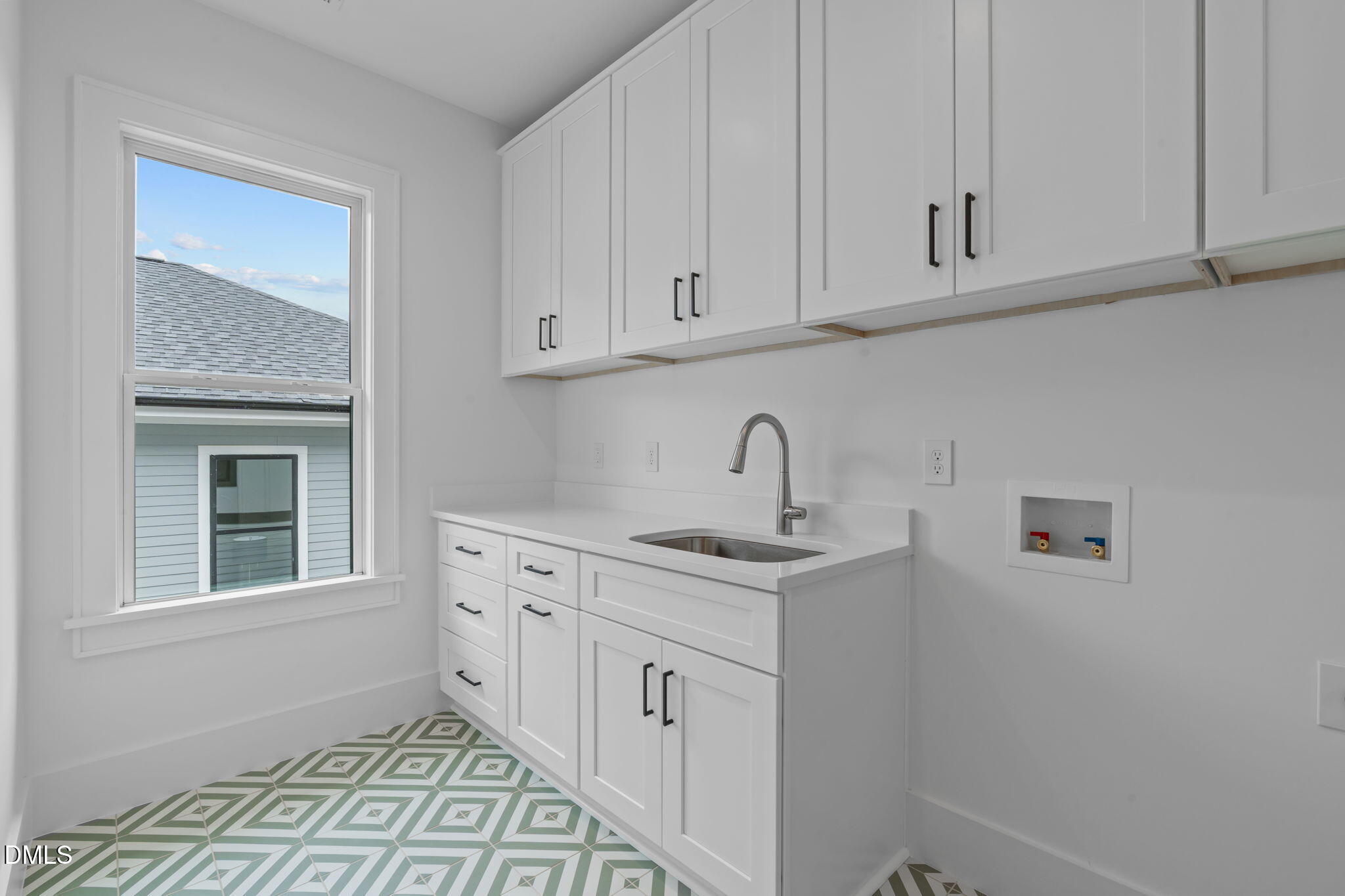 1012 Addison Place Raleigh, NC 27610 - Photo 37 of 56 a kitchen with white cabinets and sink