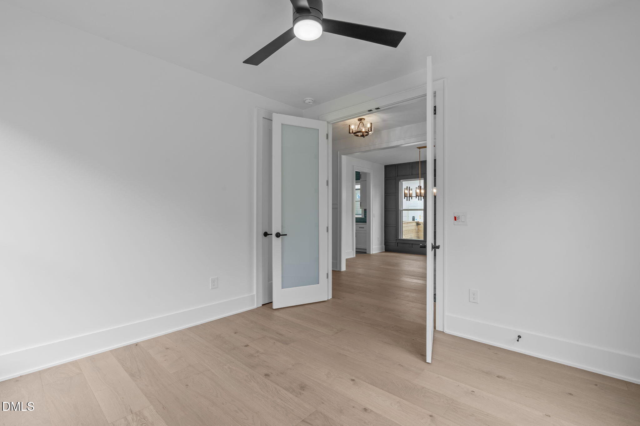 1012 Addison Place Raleigh, NC 27610 - Photo 4 of 56 an empty room with a empty space and a ceiling fan