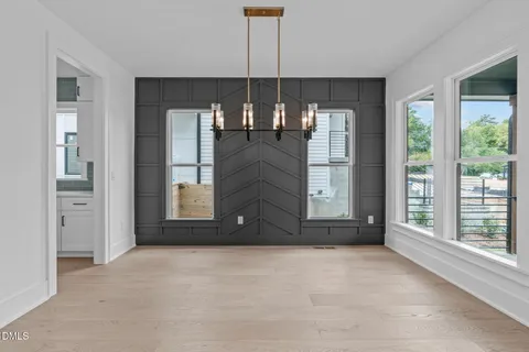 an empty room with a empty space and a ceiling fan