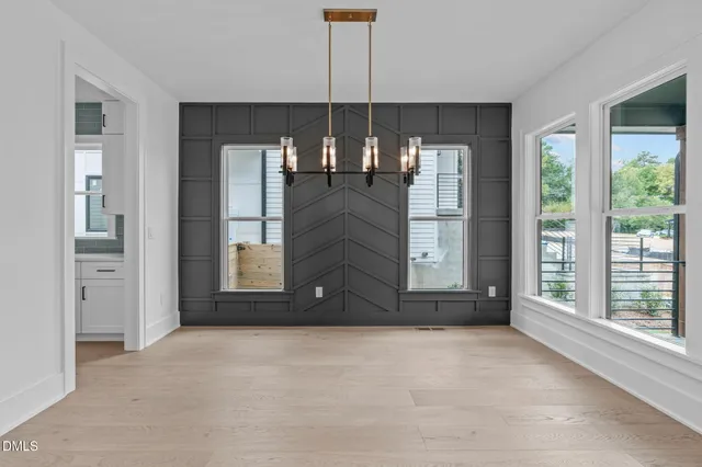 an empty room with a empty space and a ceiling fan