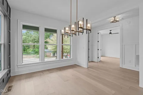 a view of a kitchen with a sink and a large window