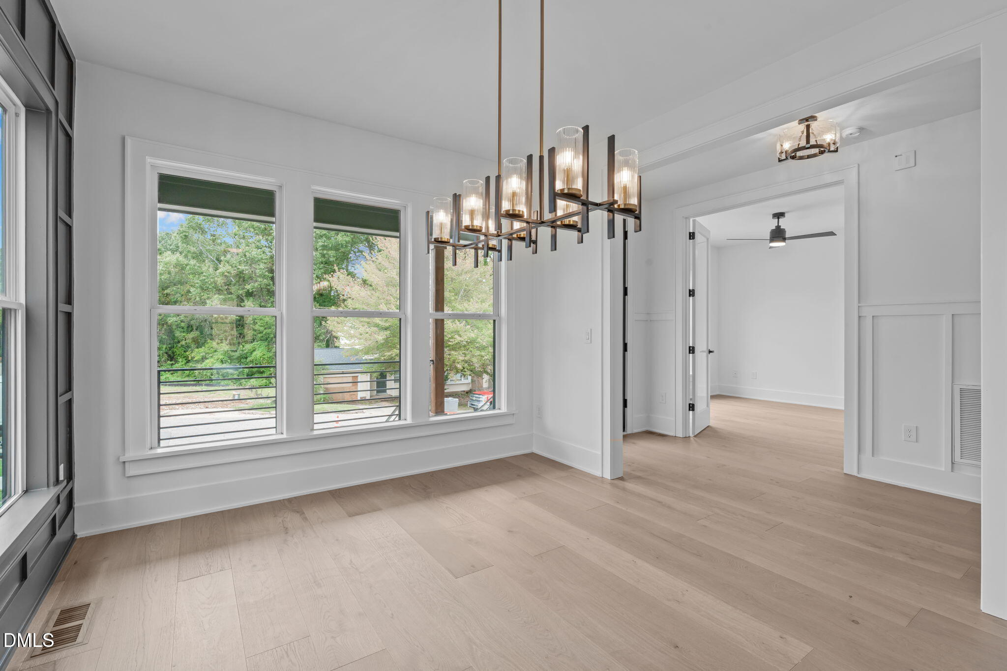 1012 Addison Place Raleigh, NC 27610 - Photo 6 of 56 a view of empty room with wooden floor and fan