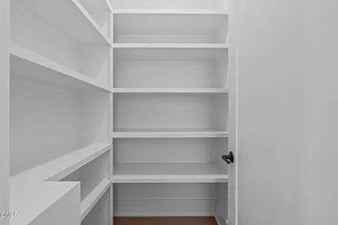 a view of cabinets a window and a wooden floor