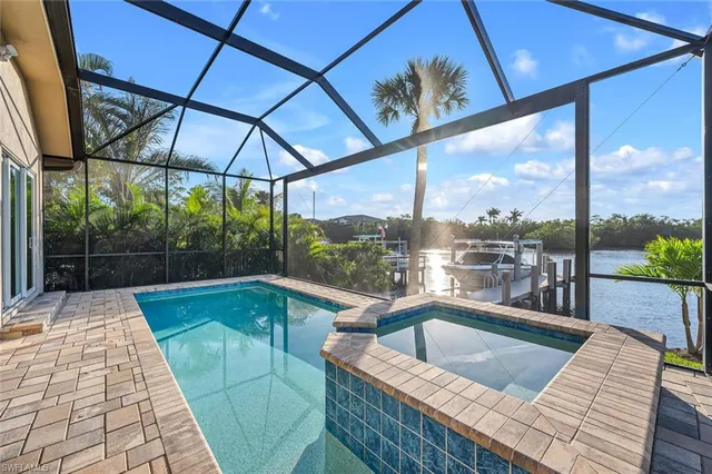 a view of a patio with a table chairs