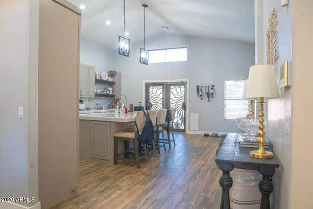 a view of a dining room with furniture and wooden floor