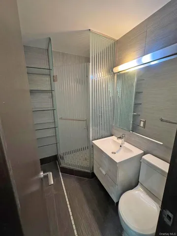 a view of a room with wooden floor and windows