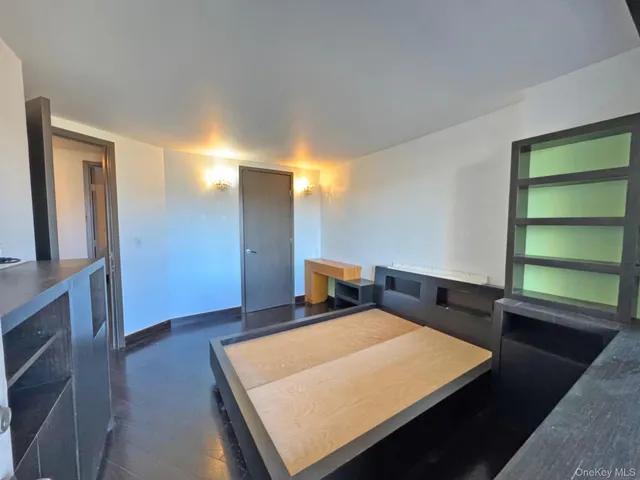 a view of balcony with wooden floor and fence