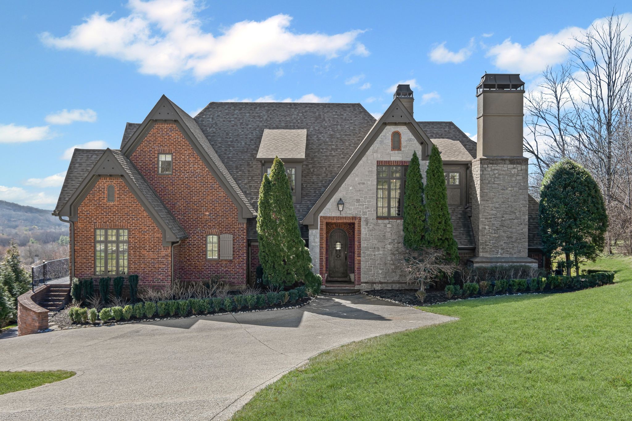 513 Legends Ridge Court Franklin, TN 37069 - Photo 2 of 89 a front view of a house with garden