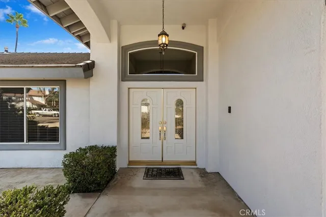 a view of an empty room with a fireplace and a window