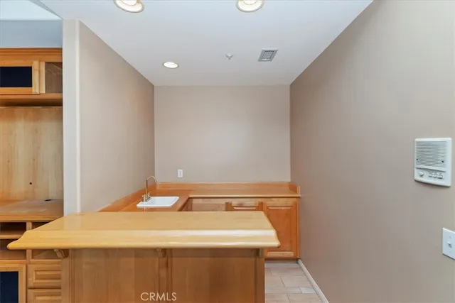 a kitchen with stainless steel appliances granite countertop a refrigerator sink and cabinets