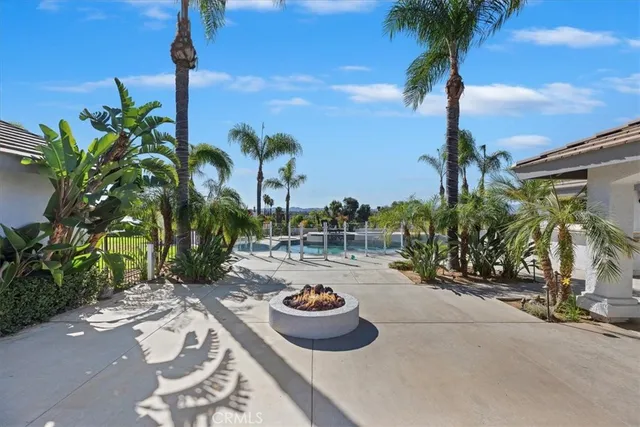 a view of swimming pool with a table and chairs
