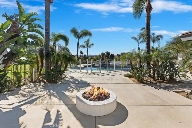 a view of a swimming pool with a yard