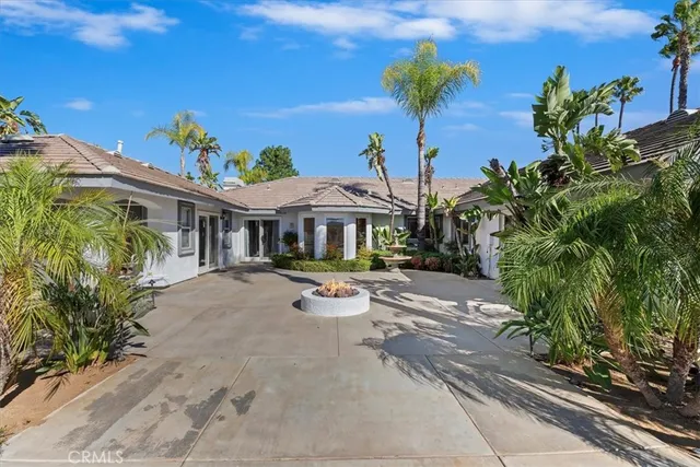 a view of a swimming pool with a yard